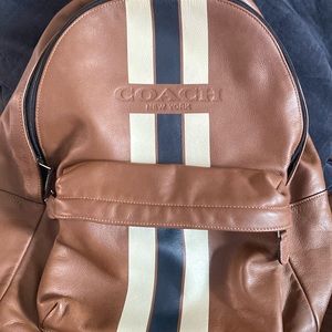 Coach backpack, brown with cream and black stripes. Very rarely used.